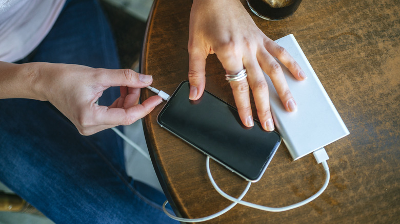 mobile phone plugged into power bank