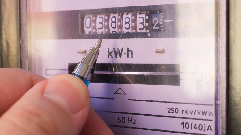 ballpen pointing at electricity meter