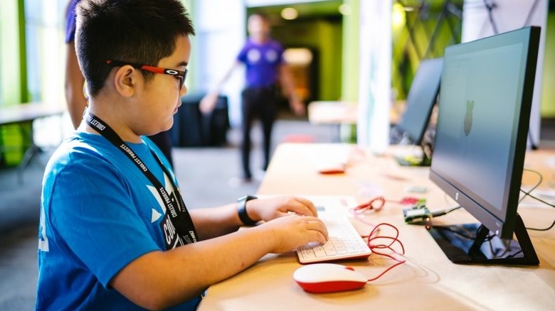 Boy using Raspberry Pi as desktop computer