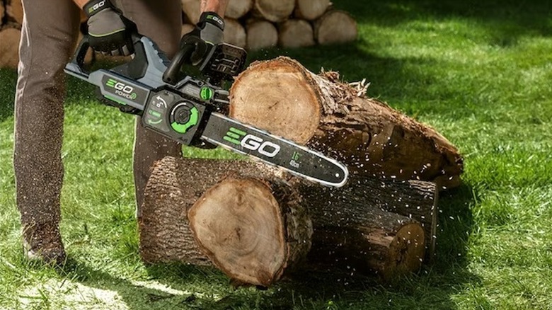 EGO tools chainsaw cutting logs