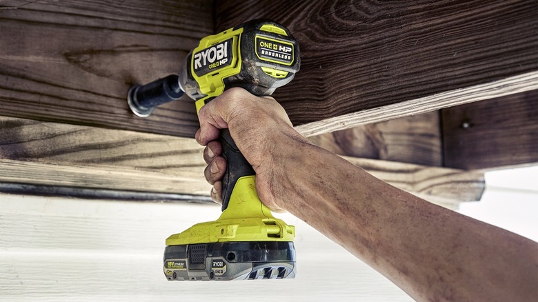 Person using impact driver