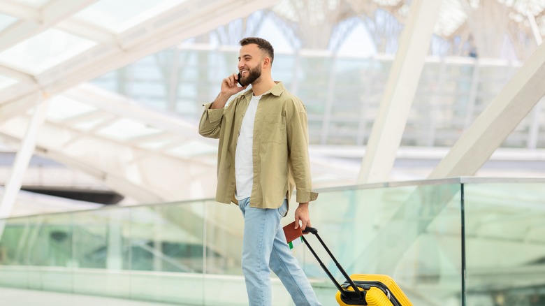 calling on phone in airport