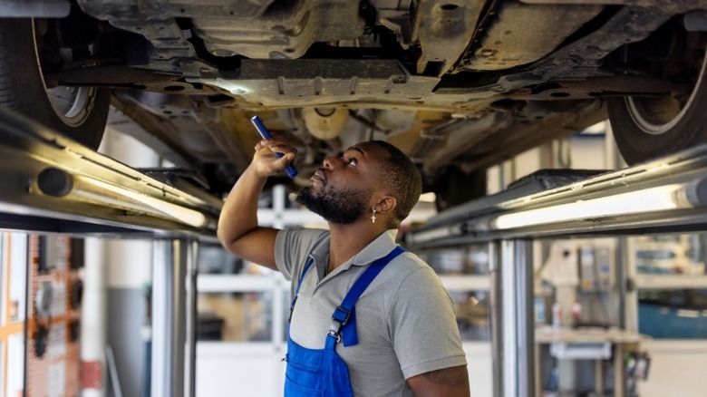 mechanic inspecting a car