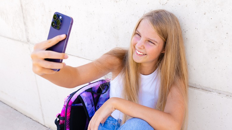 Women taking unaligned photo