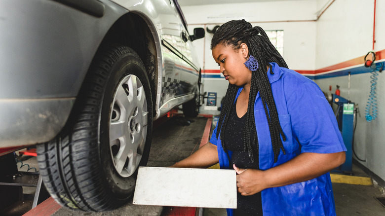 Mechanic performing a tire alignment