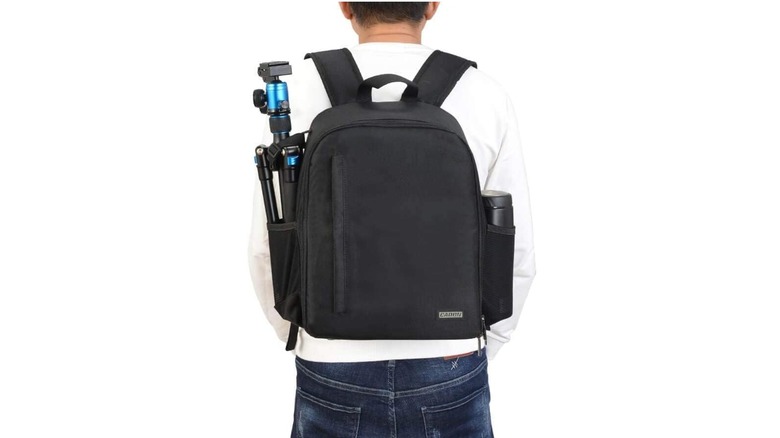 Man wearing a CADeN camera backpack