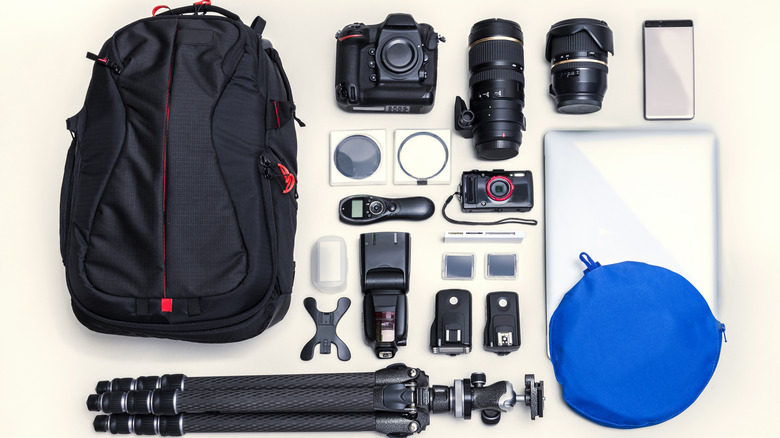 Camera bag with gear laid out on display