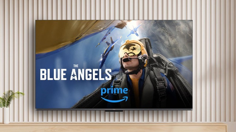 TCL Q6 QLED displaying Blue Angels show and mounted on wall