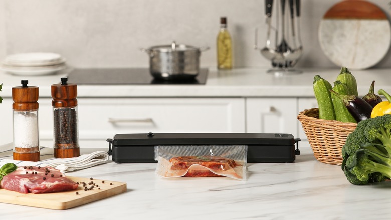 vacuum sealer surrounded by food