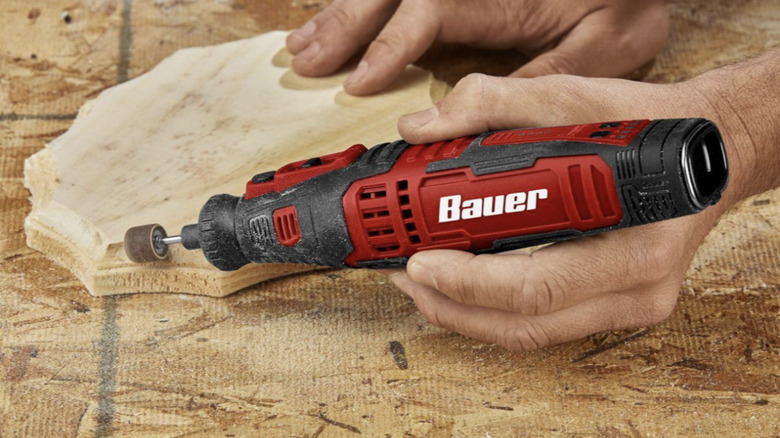 Person using Bauer rotary tool 