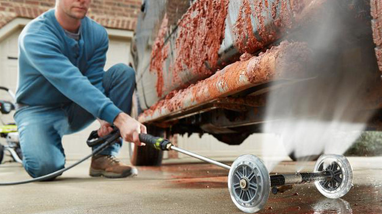 person using Ryobi 11-inch Water Broom