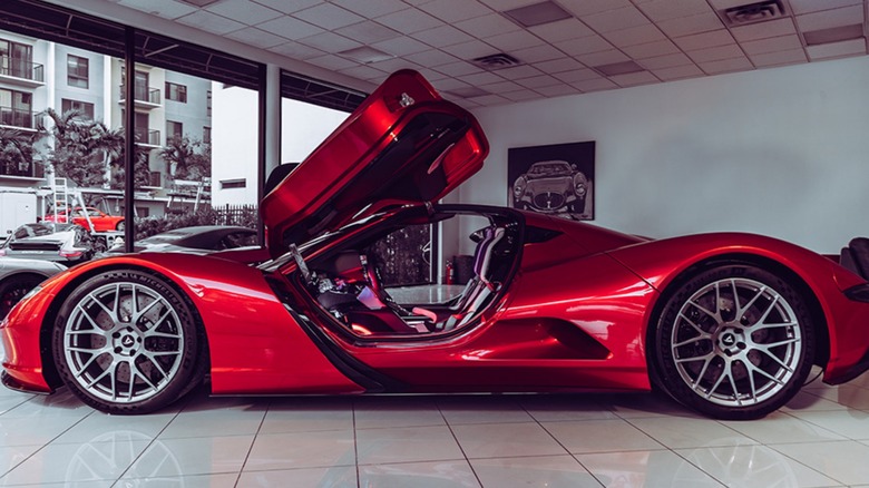 A red aspark owl with the scissor doors open