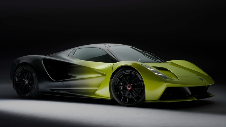 A yellow and black lotus evija hypercar