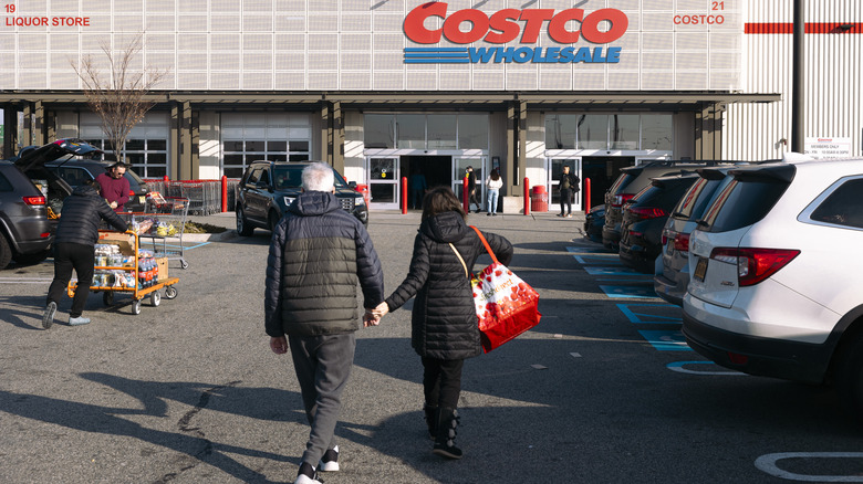 couple walking toward costco warehouse