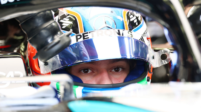 Racing driver sitting inside their car