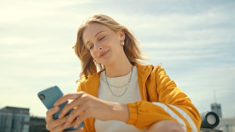 Woman typing on her phone