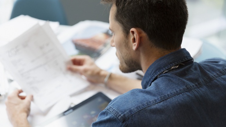 Man staring at some documents