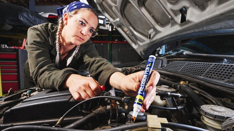 woman using WD-40 Precision Pen