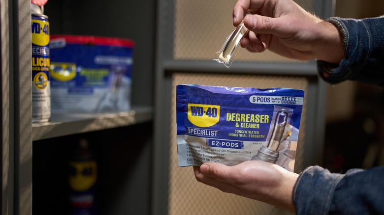 person holding bag of WD-40 Specialist Degreaser and Cleaner EZ-Pods