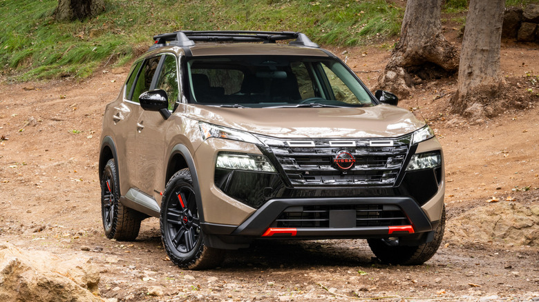 2025 Nissan Rogue parked in the woods