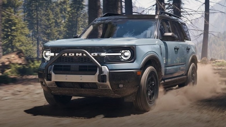 Ford Bronco driving on a dirt road