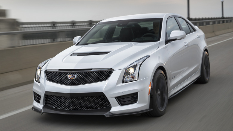 The Cadillac ATS-V in white on the move, front 3/4 view