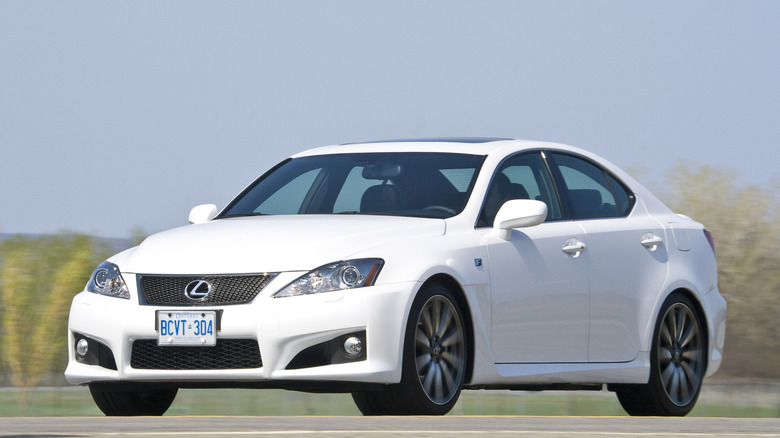 A white Lexus IS F on the move, front 3/4 view