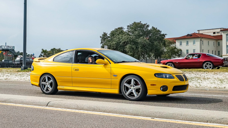 The Pontiac GTO in yellow, front 3/4 view