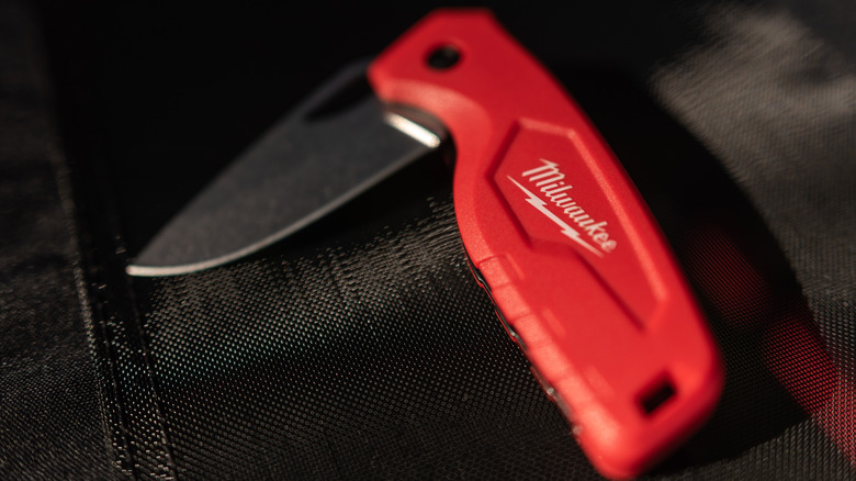 Milwaukee foldout knife on black fabric