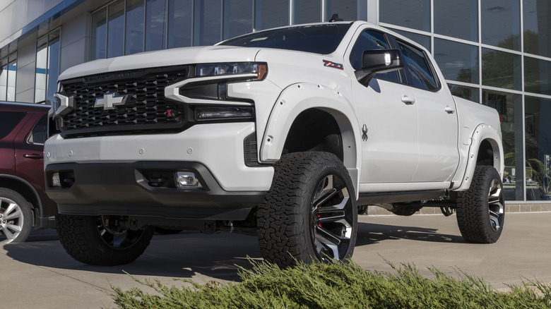 A white Chevy Silverado on a dealership lot