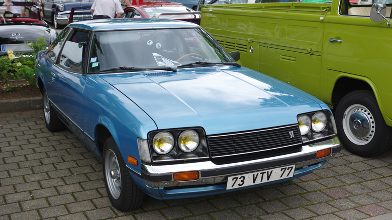 blue 1978 Toyota Celica parked in brick driveway