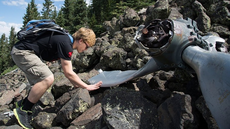 Boy Scout investigating B-24 Wreckage