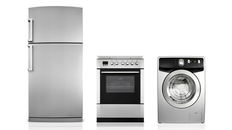 Refrigerator, stove, and washing machine on a white background.