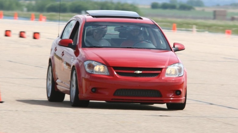 Chevrolet Cobalt SS Sedan driving on a track with orange cones in the background