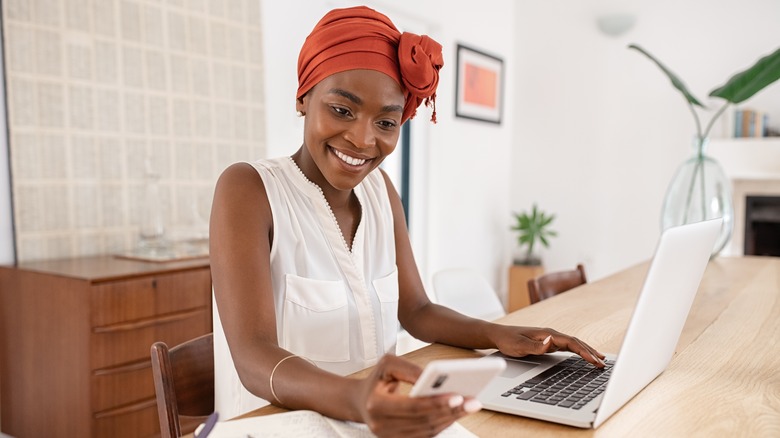 Woman using mobile phone at work