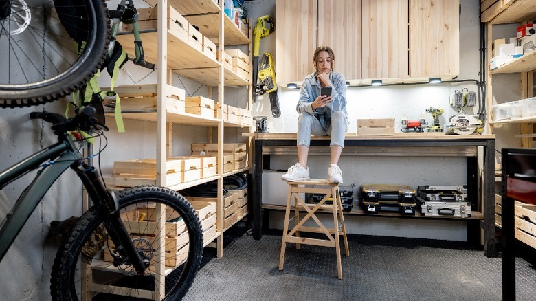 person sitting in home workshop