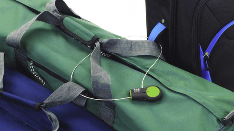 Retractable cable padlock with a green bag