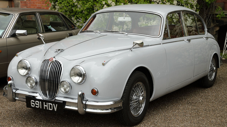 White 1958 Jaguar 3.4 saloon parked