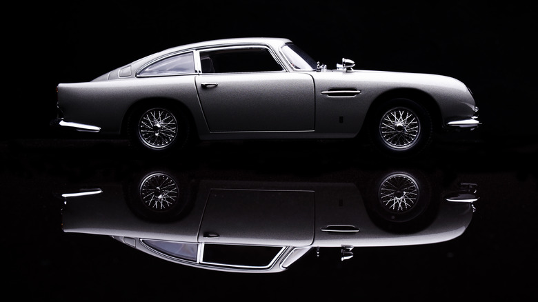 Aston Martin DB5 model on reflective surface