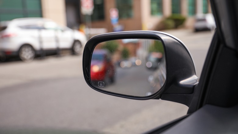 A car's left-hand side-view mirror.