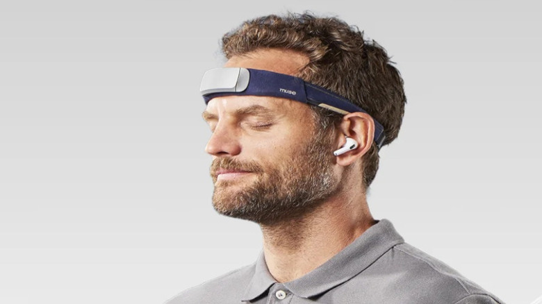 Man wearing a blue electronic headband