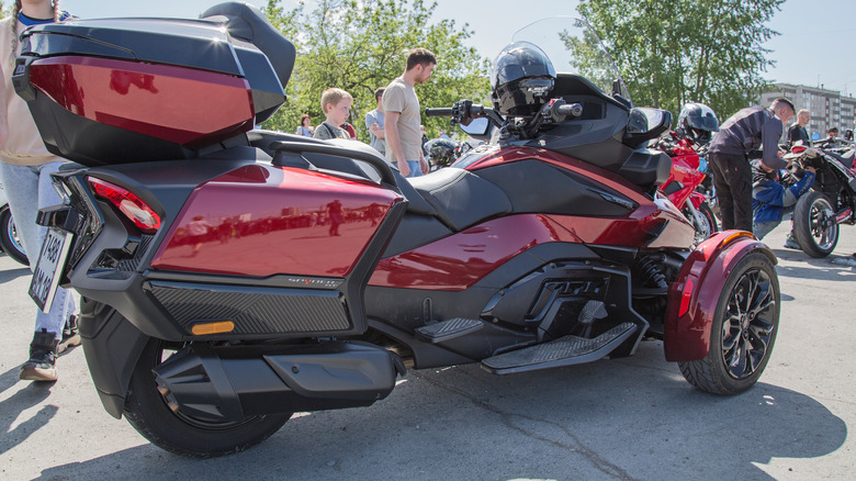 Maroon Can-Am Spyder RT in parking lot