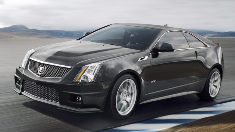 black 2014 Cadillac CTS-V Coupe driving on track