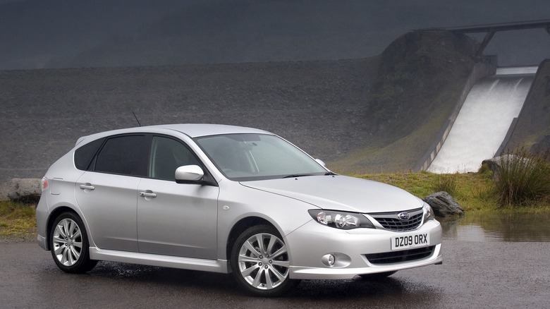 The third generation Subaru Impreza hatchback in silver, front 3/4 view