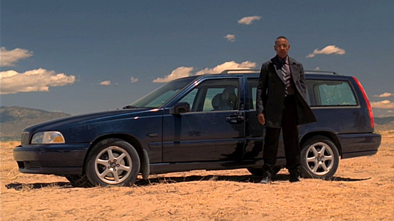 Gus Fring standing by his Volvo station wagon