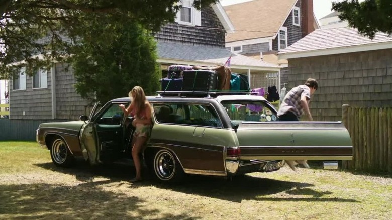 Duncan hopping out of the Buick Estate