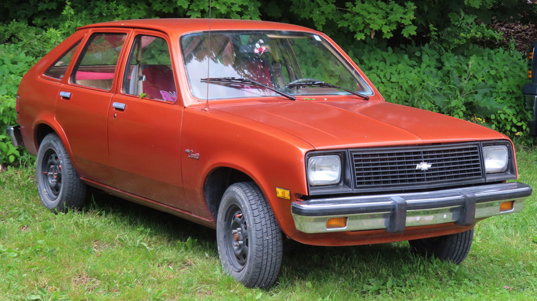 Red 1981 Chevette parked in grass