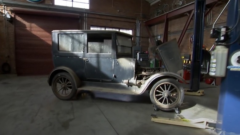 Photo of the 1919 Franklin Series 9 parked in Corky Coker's garage on episode of American Pickers.