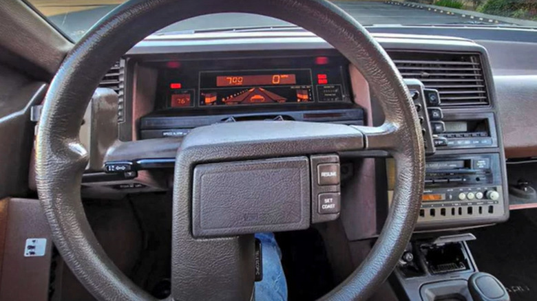 Subaru XT dashboard showing steering wheel, instrument panel and digital screen