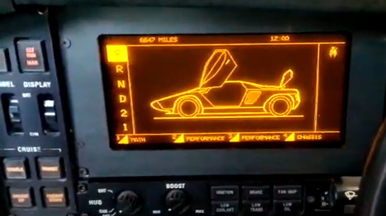 Vector W8 dashboard showing the digital display which shows an image of the car